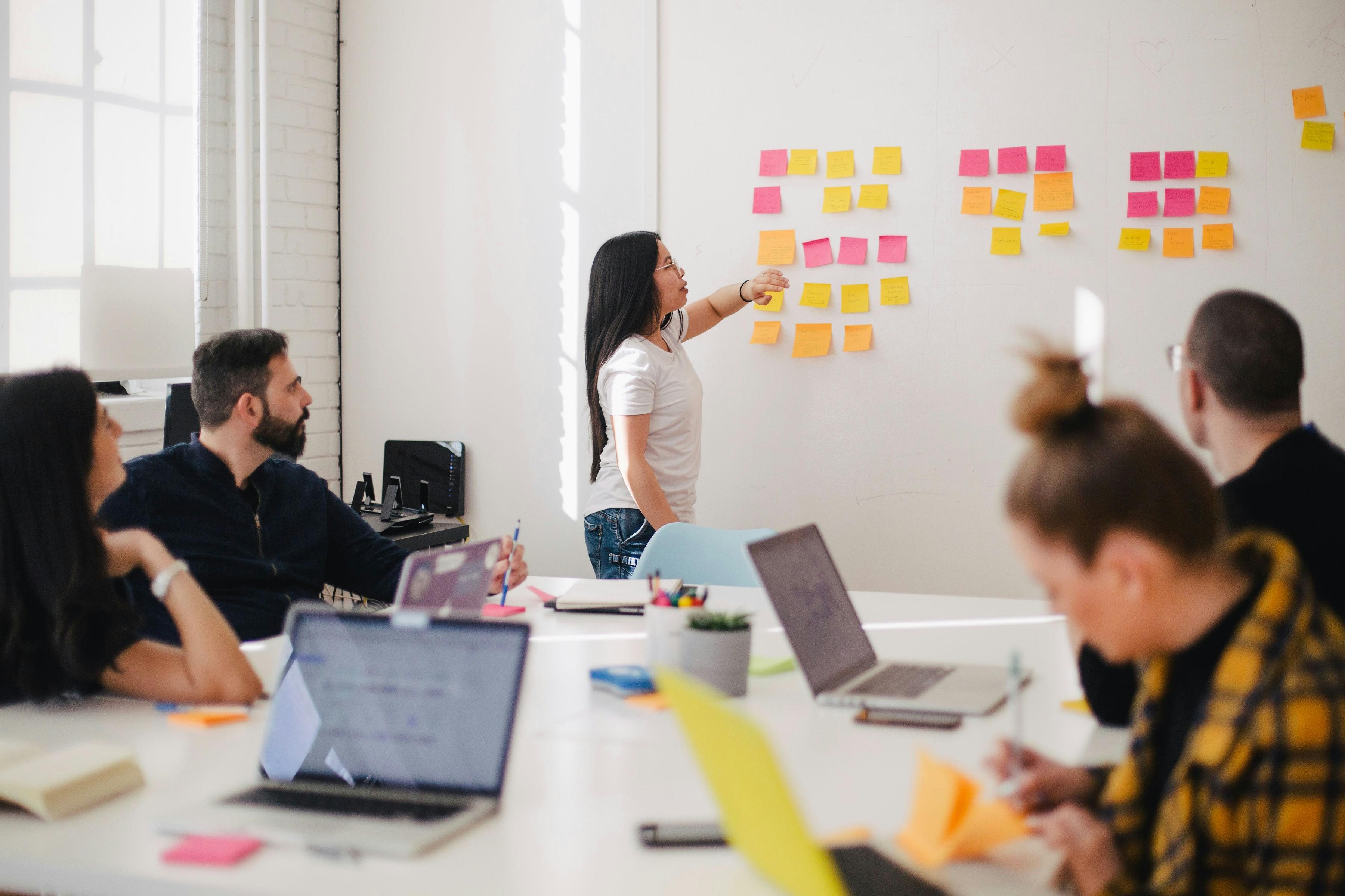 A team planning work together in a bright workspace